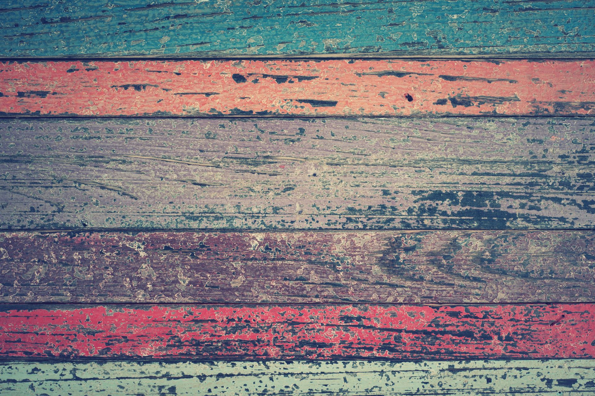 Vibrant, rustic wooden planks with a worn, weathered texture create a unique design.