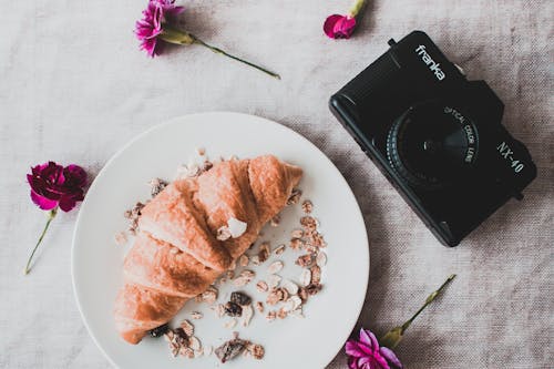 Black Franka Dslr Camera Beside Croissant