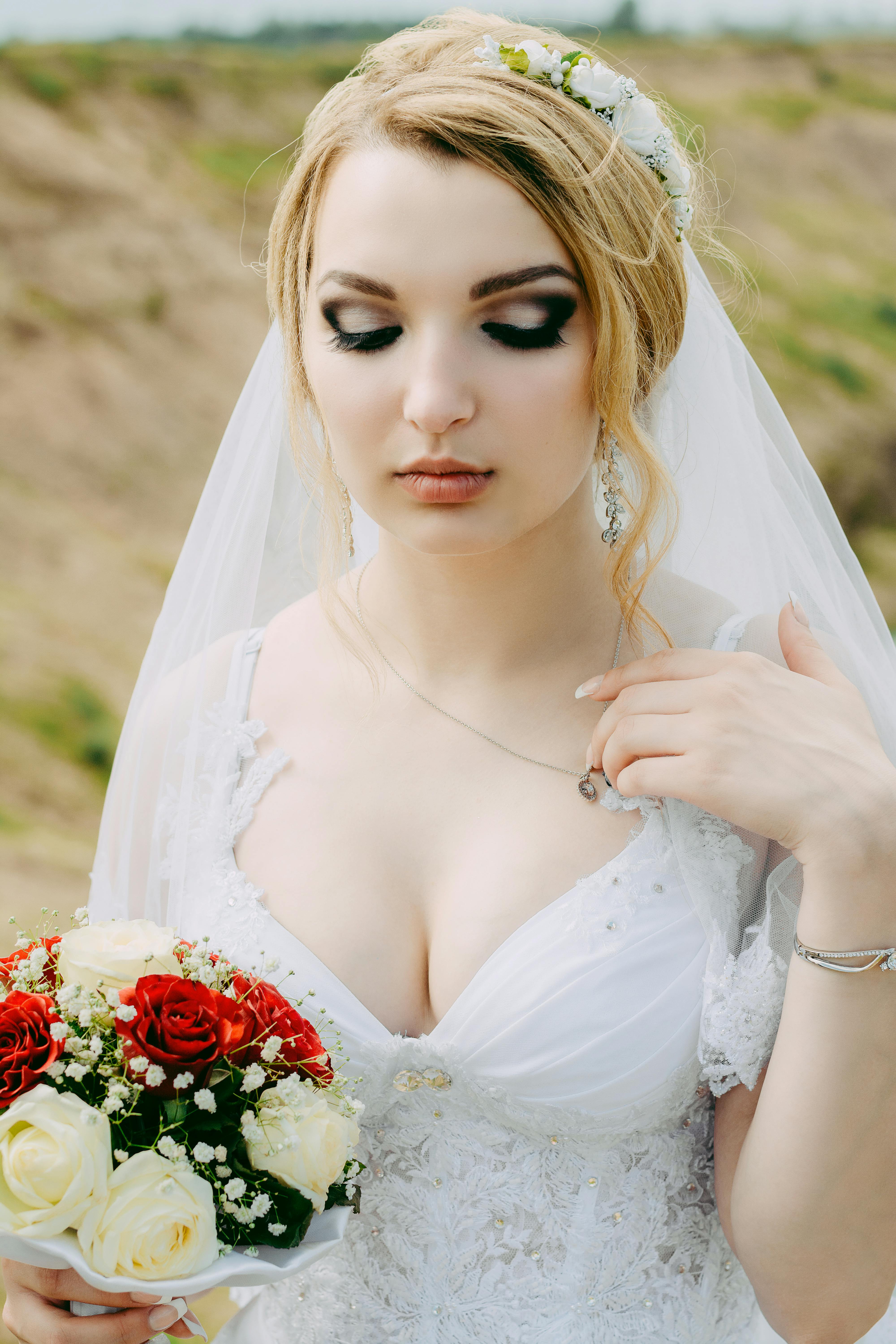 Woman Wearing White Lace Surplice-neck Wedding Gown