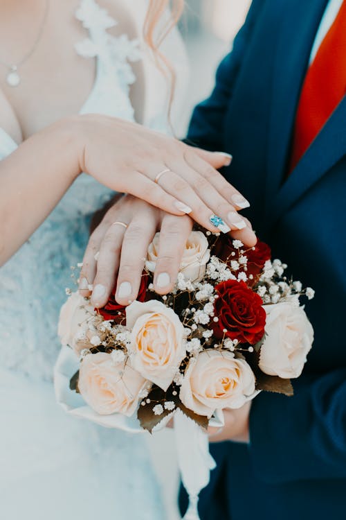 Free Person Holding Bouquet of White Nad Red Rose Stock Photo