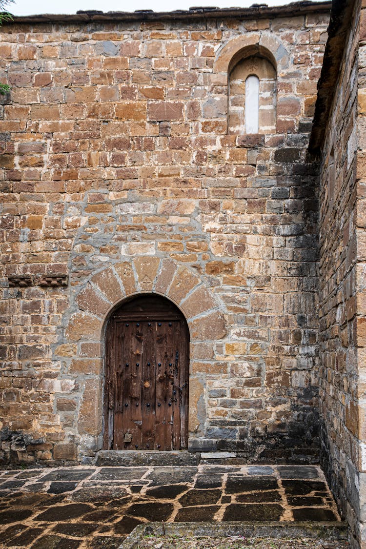 A Wooden Door On A Cobblestone Structure