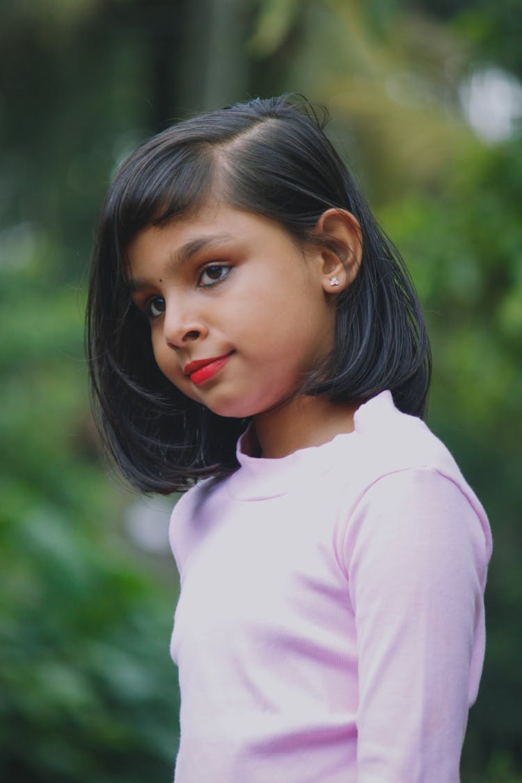 A Young Girl In Pink Long Sleeves