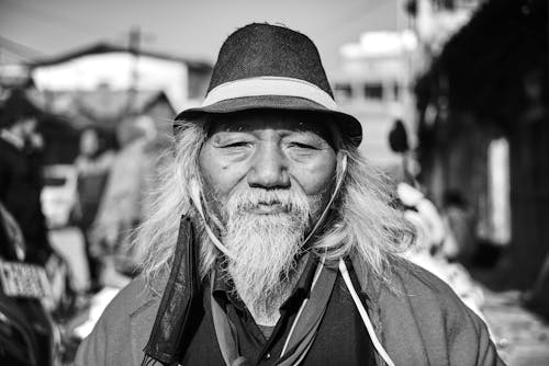 An Old Man Wearing Black Hat