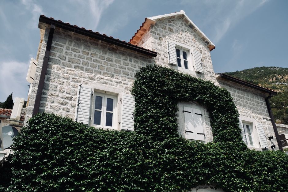 Exterior of a traditional guesthouse or 'sobe' in rural Montenegro, ready for guest registration.
