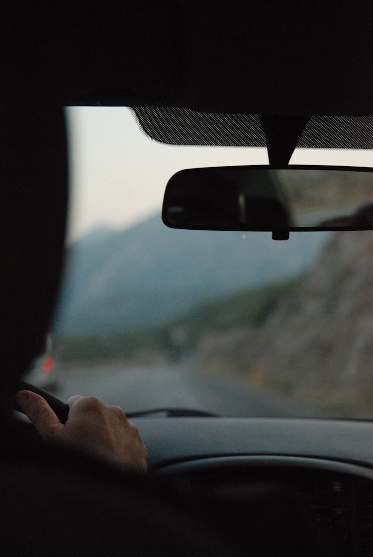 Man Driving A Car