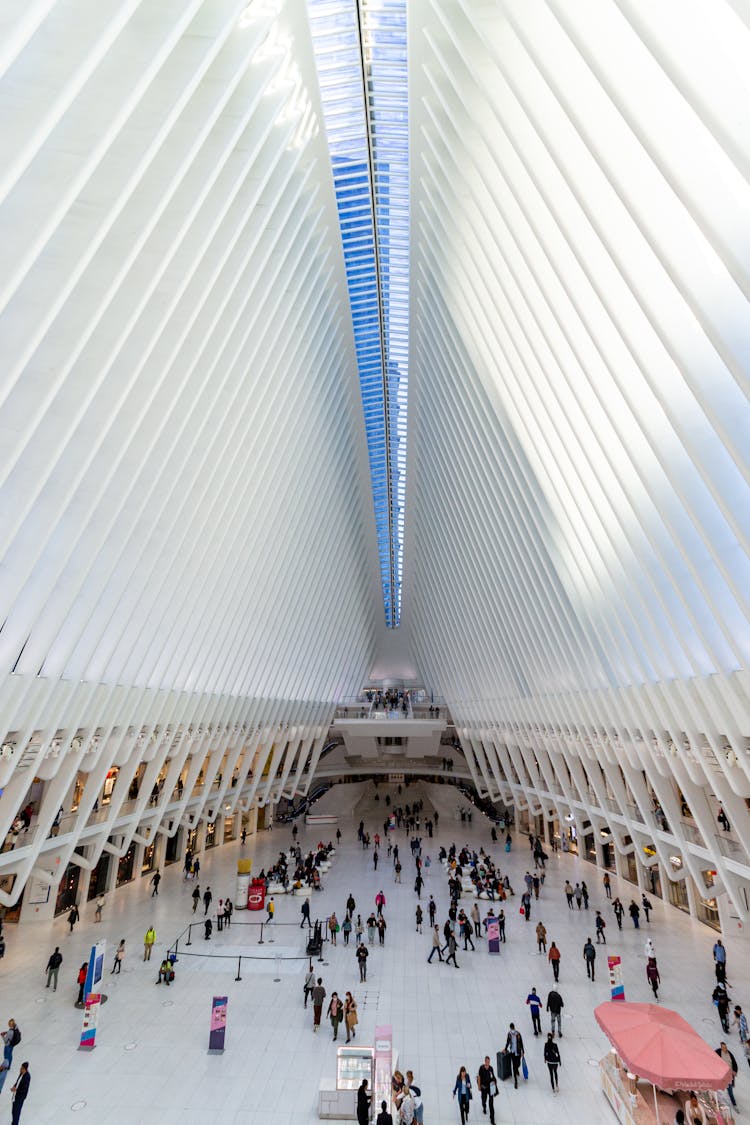 People Walking Inside The Building