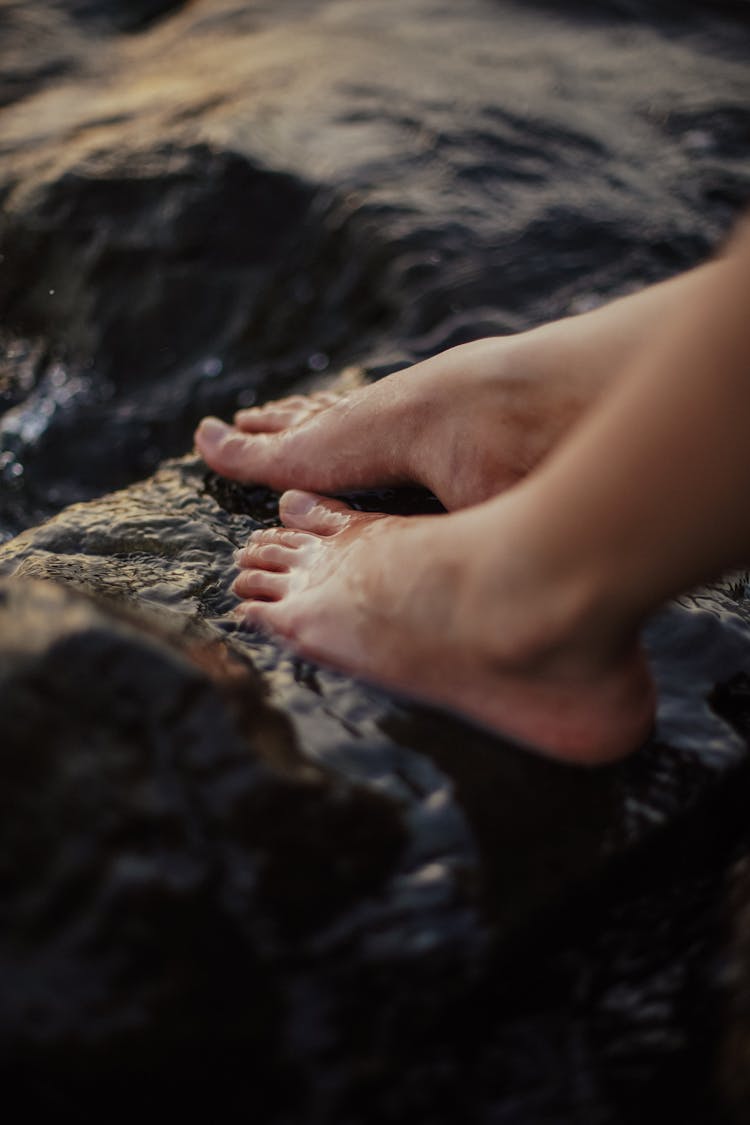 Feet On Wet Rocks