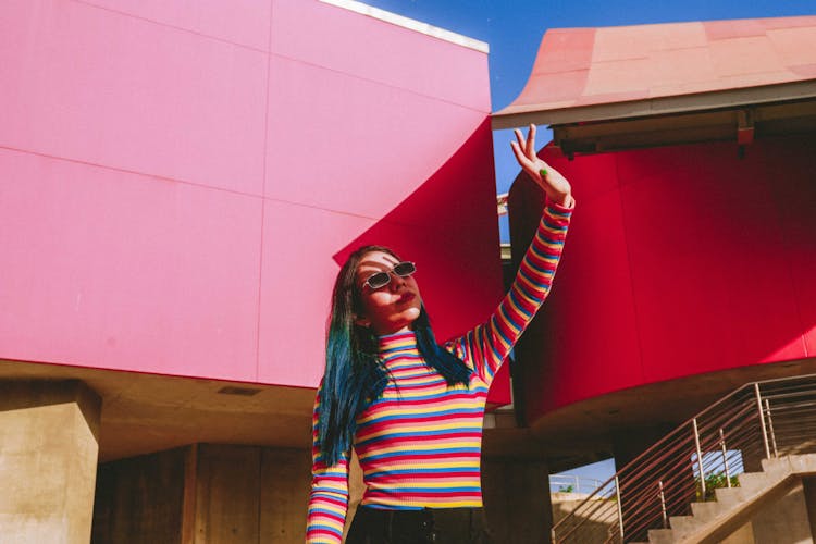 Woman Covering Face From Sunlight