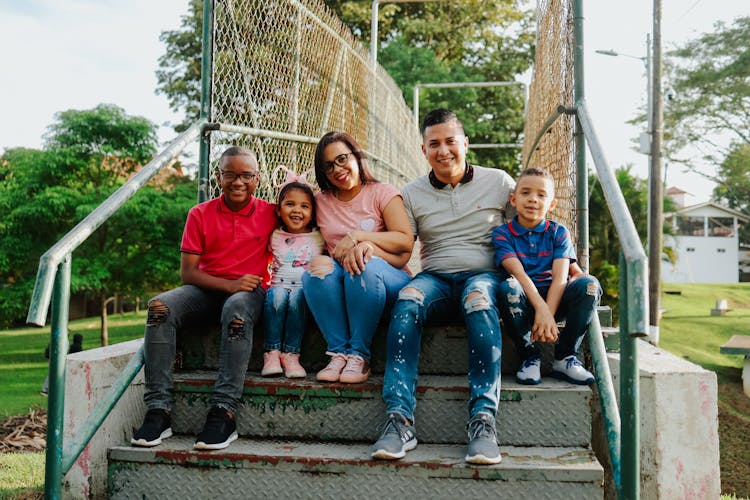 Family Posing On Stairs