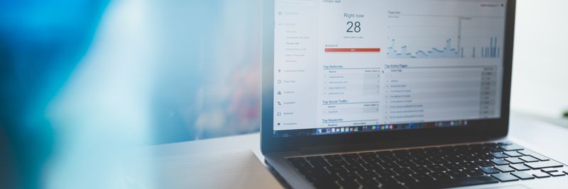 Laptop displaying Google Analytics in a modern workspace, highlighting digital analytics and technology.