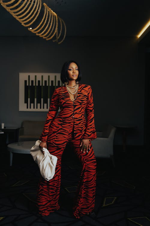 Woman Wearing a Zebra Print Black and Red Suit 