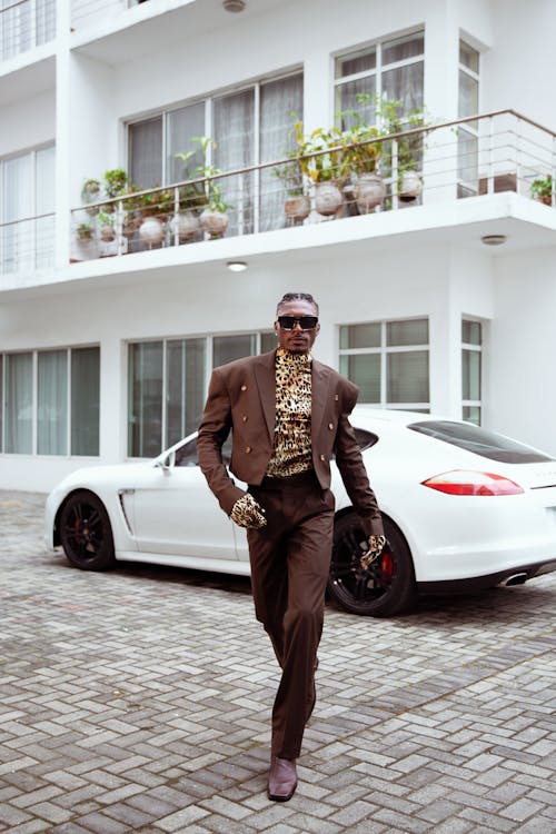 Fashionable Man in a Brown Suit and Animal Print Shirt 