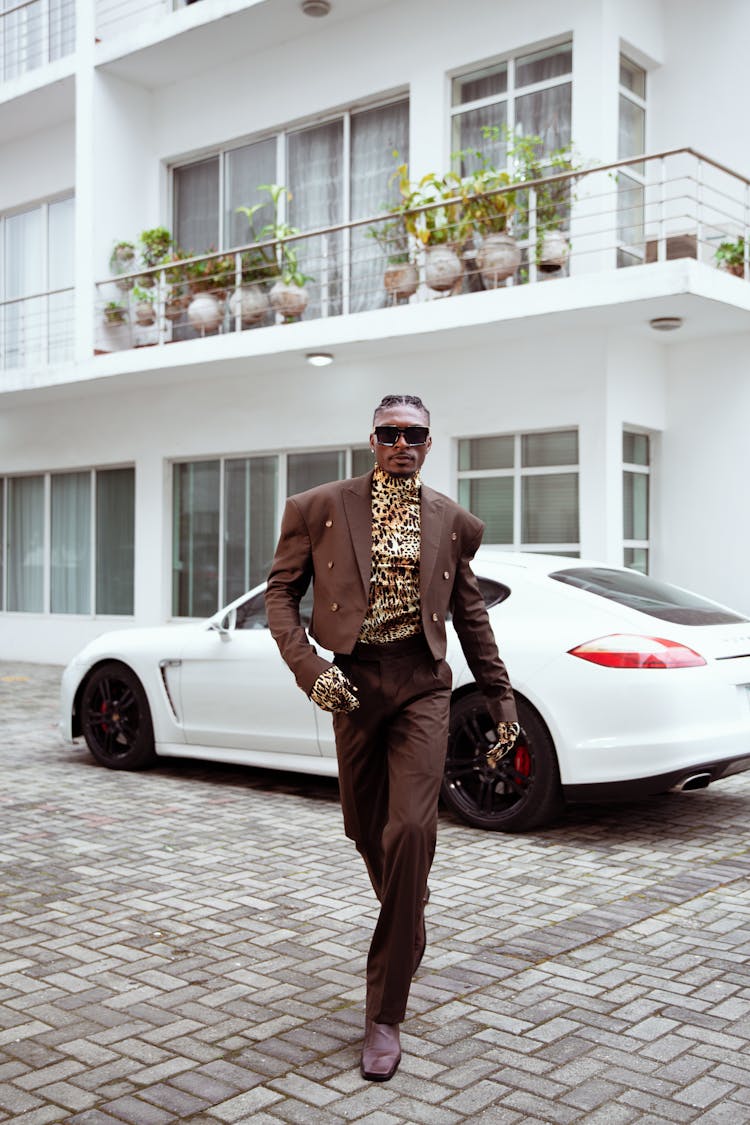 Fashionable Man In A Brown Suit And Animal Print Shirt 