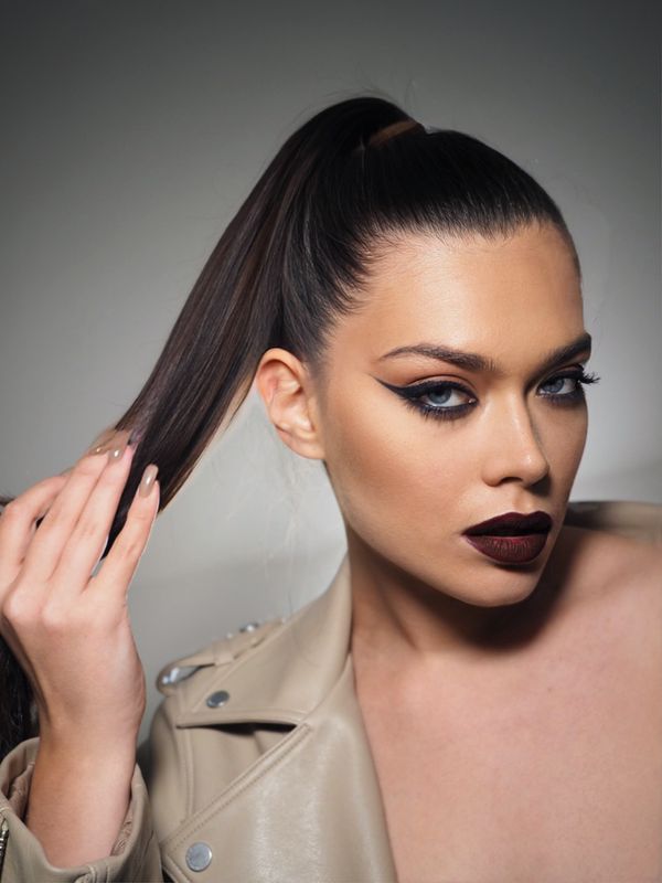 Sleek wrapped ponytail long hair party hairstyle