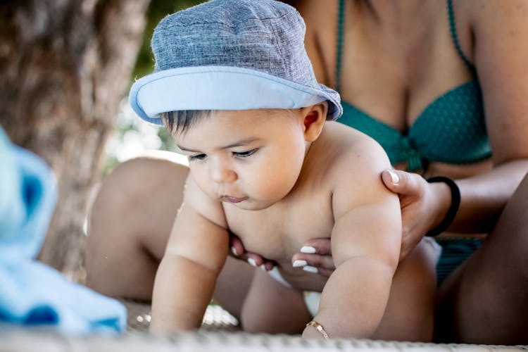 Baby Held By A Woman