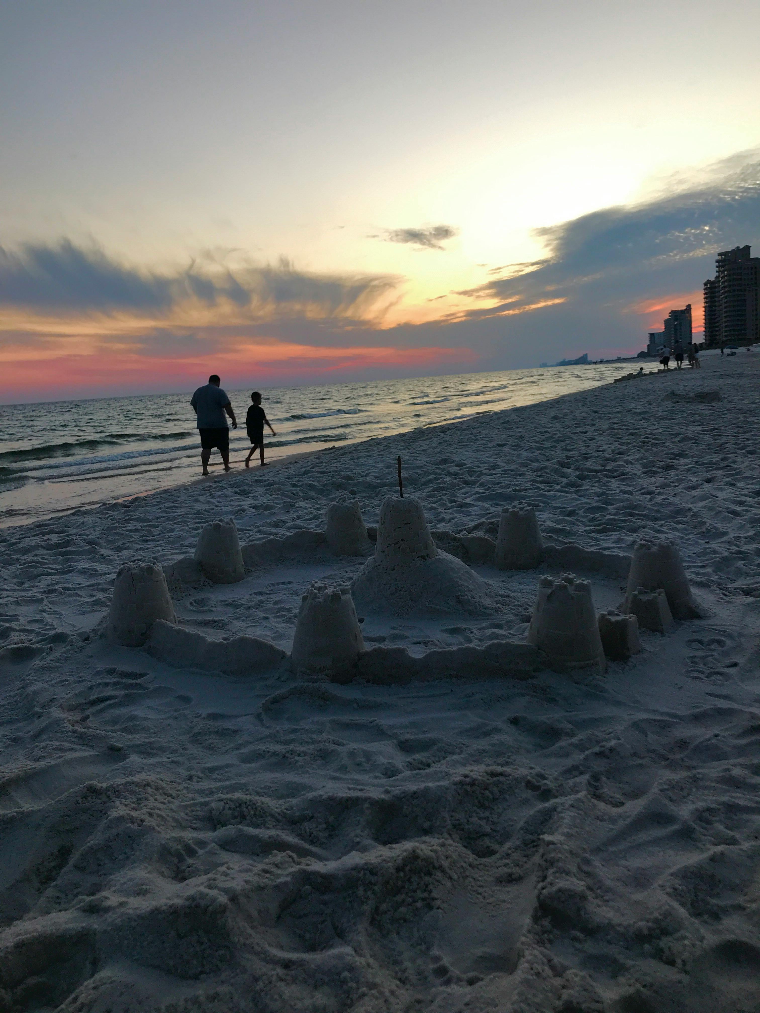 A group of diverse friends sitting on a couch, laughing and playing video games together, representing a unified gaming community.
