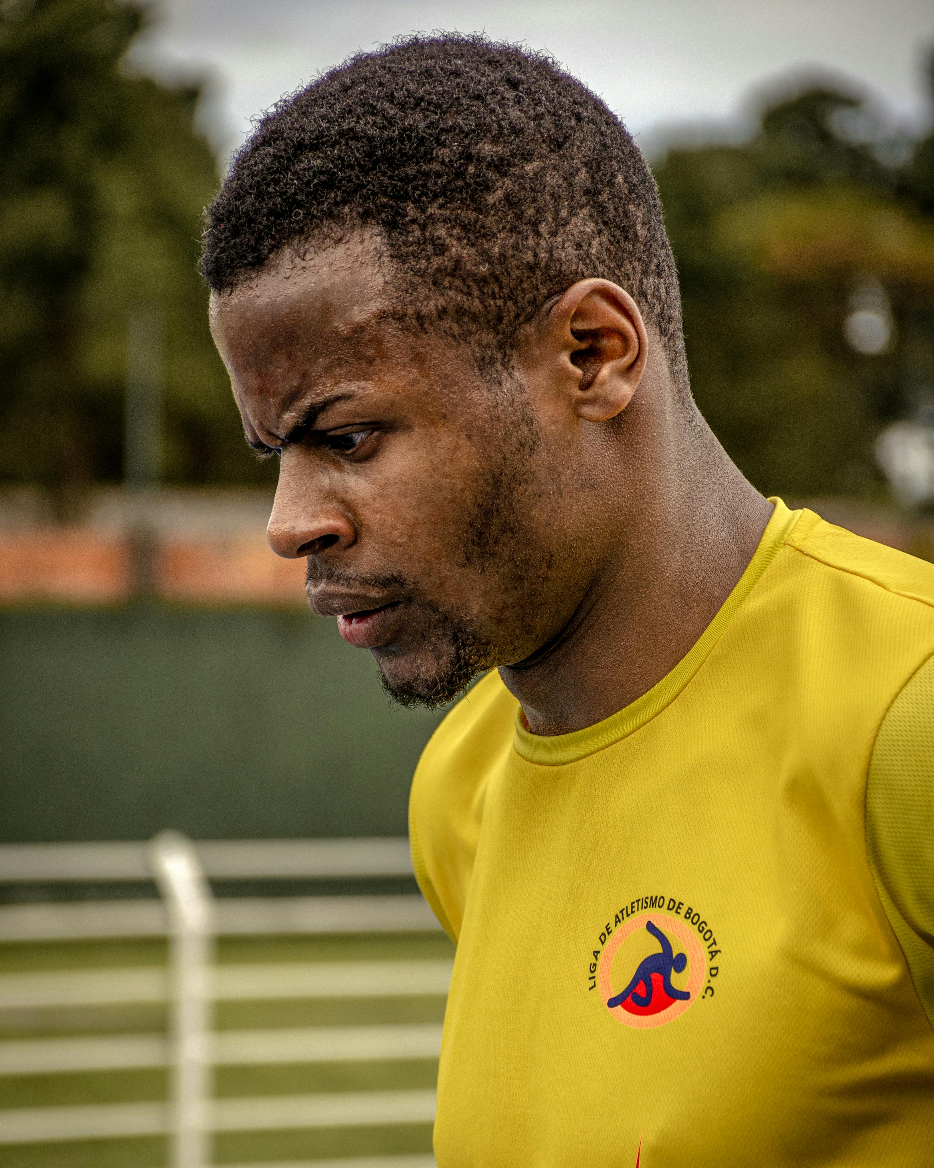 Close-up of a determined male athlete training outdoors in Bogotá, Colombia.