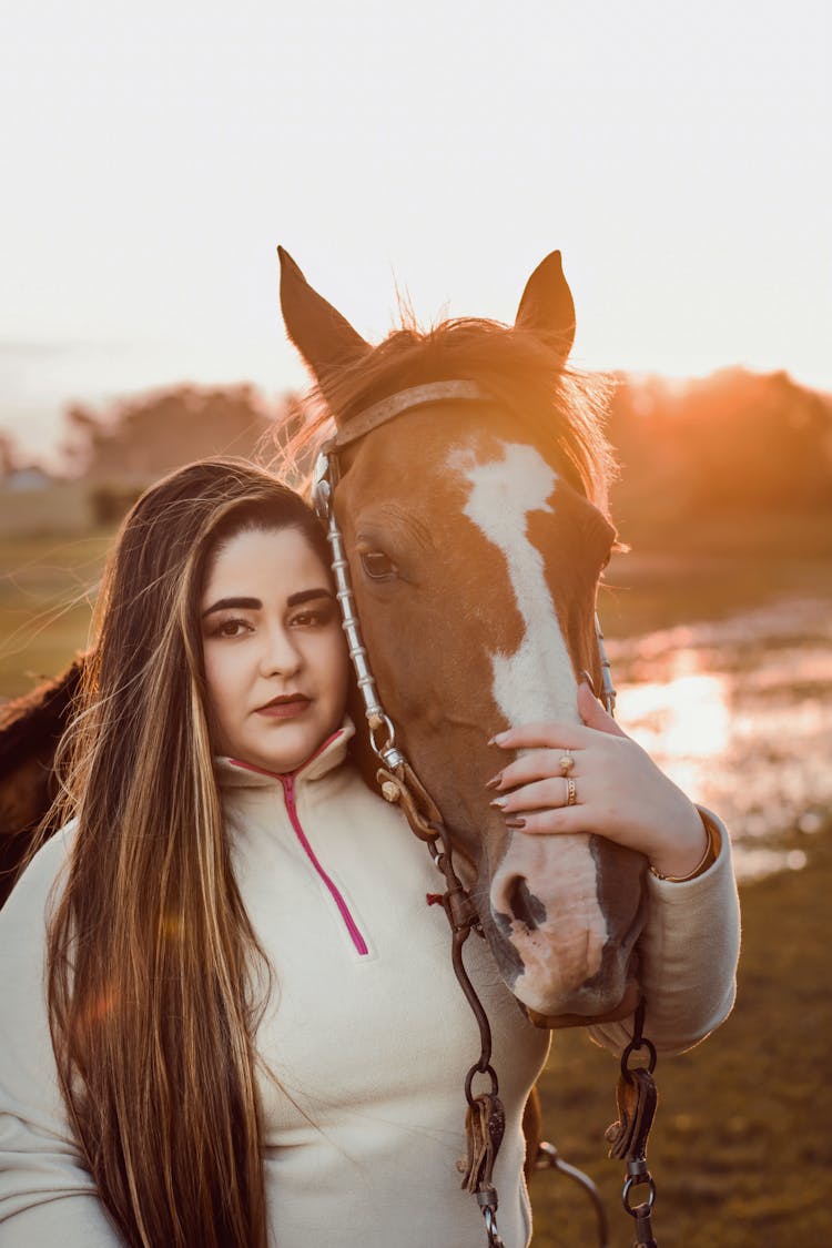 Woman Touching A Horse