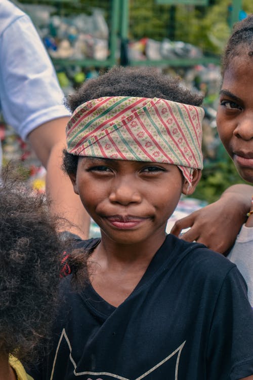 Photo of a Boy Wearing Bandana