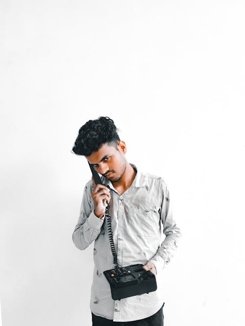 Free simple white background portrait with telephone Stock Photo