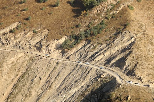 Aerial View of Road on Brown Rocky Mountain