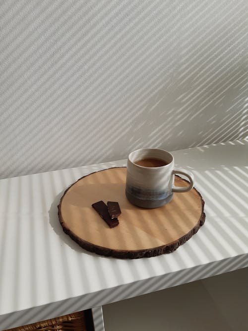 Free Cup of Coffee and Chocolate on Wooden Tray Stock Photo