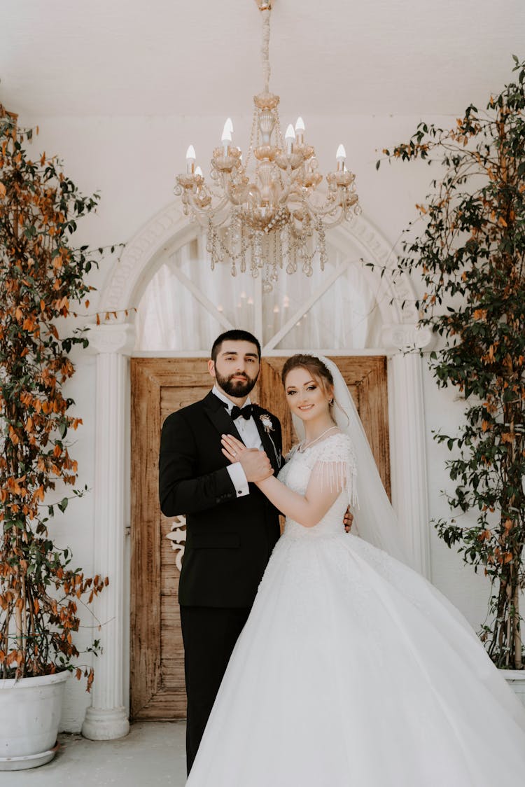 Man And Woman In Wedding Suit And Dress