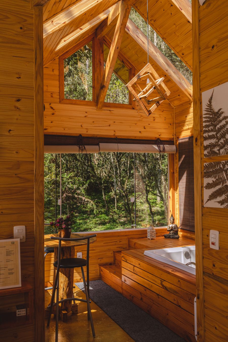 Warm wooden cabin interior with a forest view