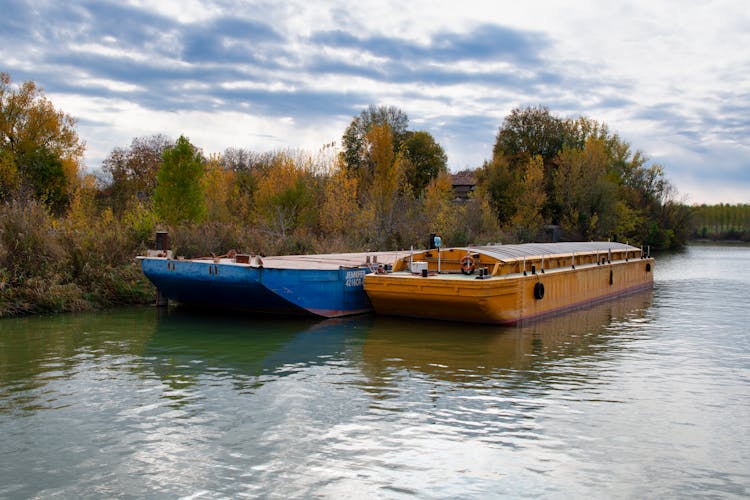 Barges Docked On Riverside