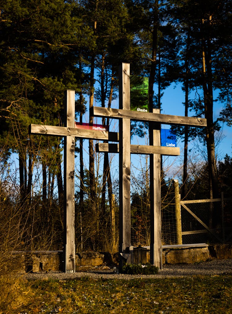 Wooden Memorial Crosses In A Forest