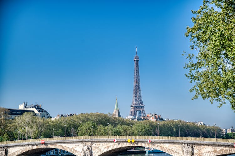 Eiffel Tower Against Blue Sky In Paris, France