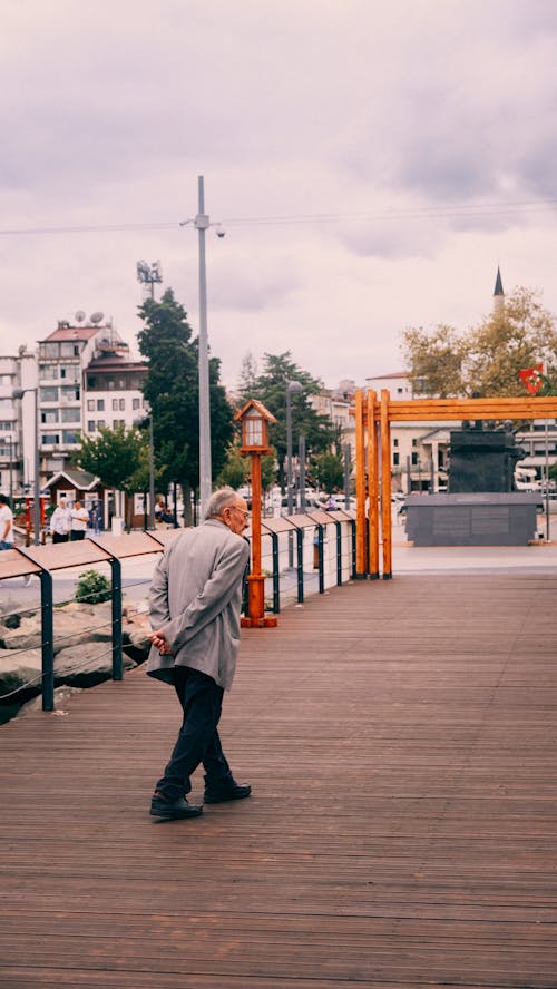 A Man Walking in a City 