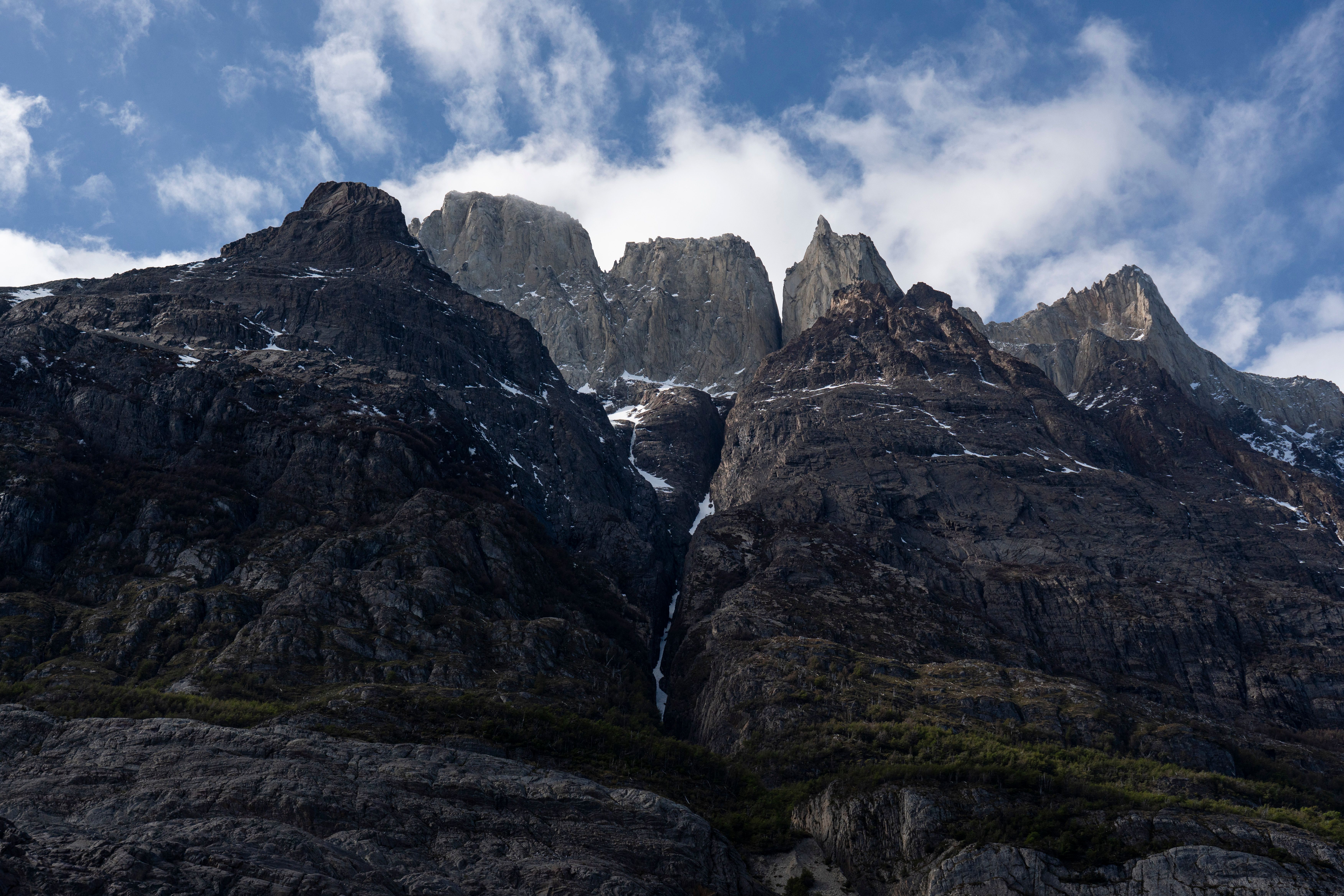 Breathtaking view of Torres del Paine's rugged peaks under a vivid blue sky in Patagonia, Chile