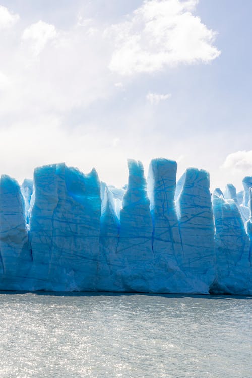 Glacier on Water under the Cloudy Sky