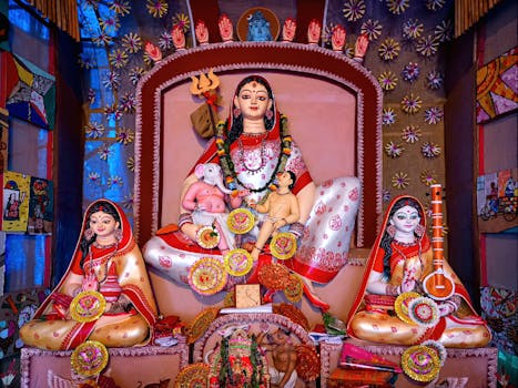 Vibrant depiction of Durga and Ganesha at a Kolkata festival celebration.