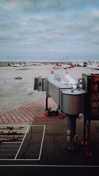 A bustling airport terminal with airplanes on the runway, perfect for travel industry use.