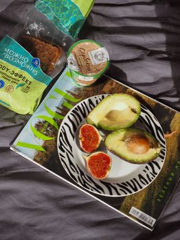 A stylish arrangement of avocado and figs on a Vogue magazine cover