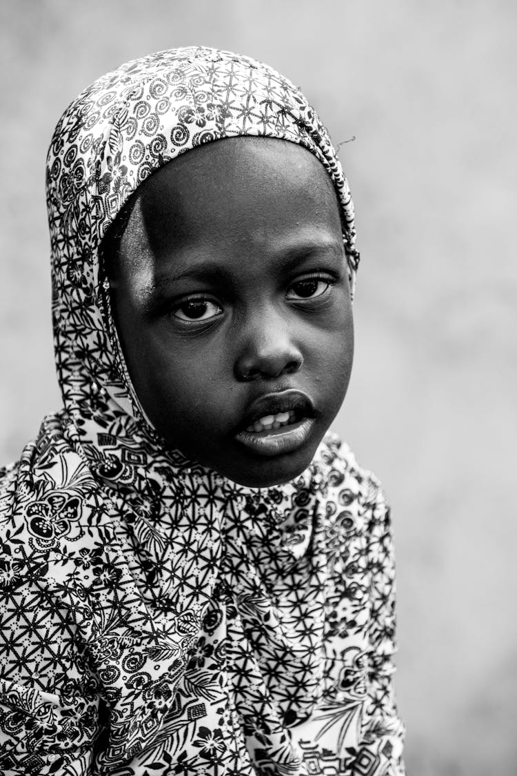 Black And White Portrait Of A Muslim Girl Wearing A Patterned Headscarf