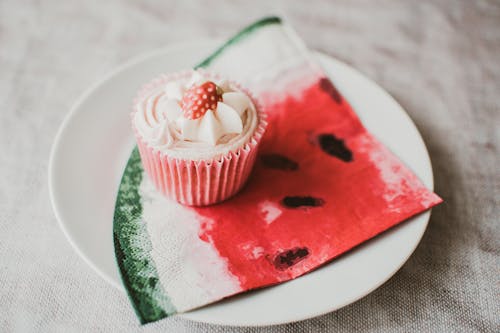 Flat Lay Photography of Cupcake on Plate