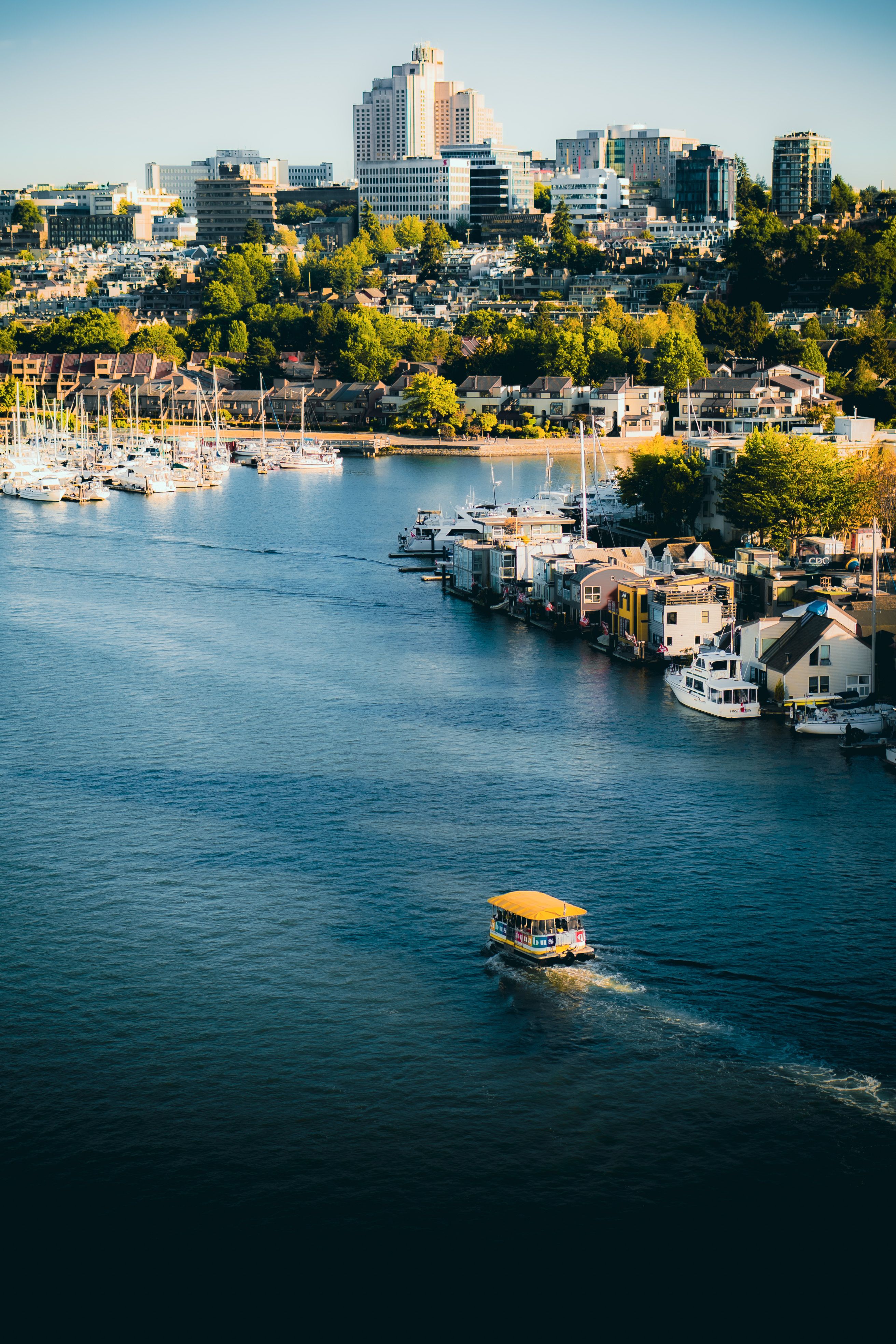 Explore the serene Vancouver waterfront featuring skyline, boats, and vibrant city life.