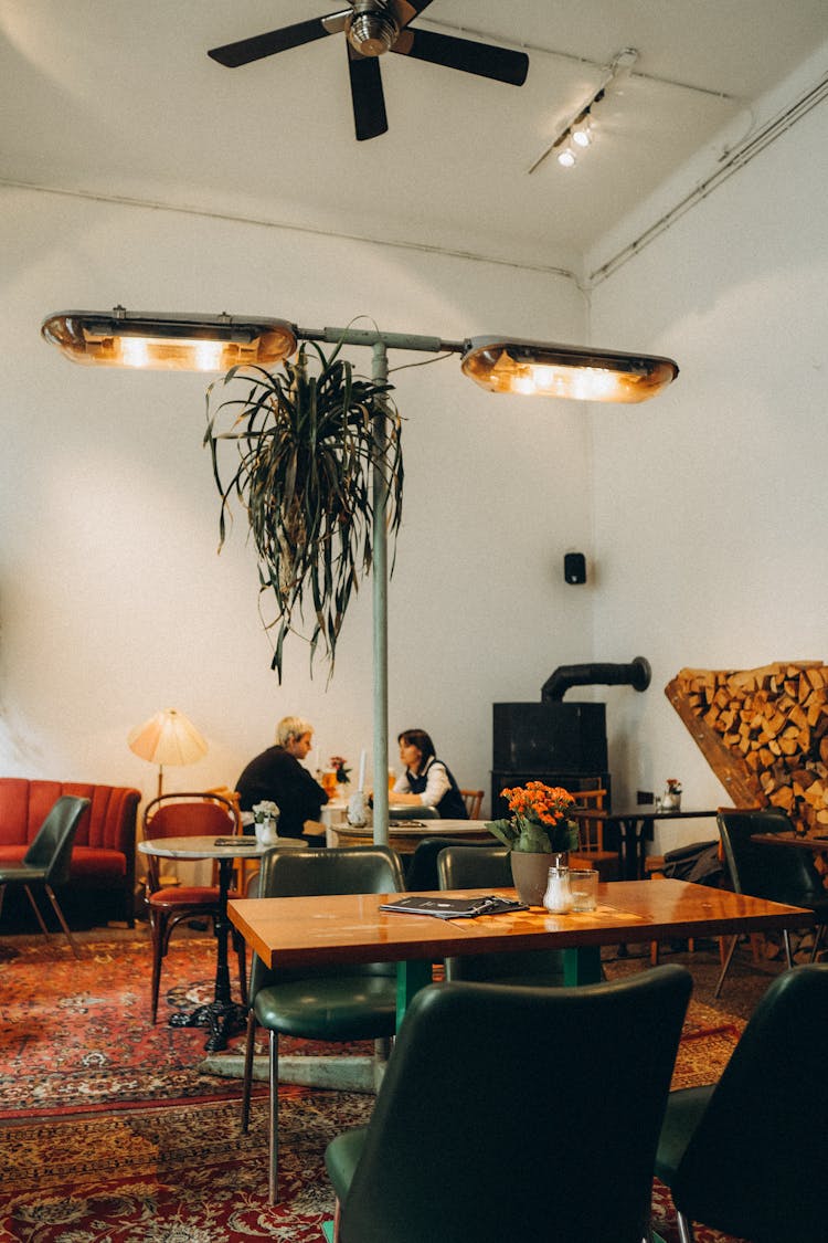 Two People Sitting In A Room 