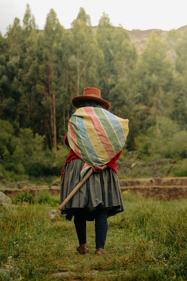 Woman Carrying Bag In Forest