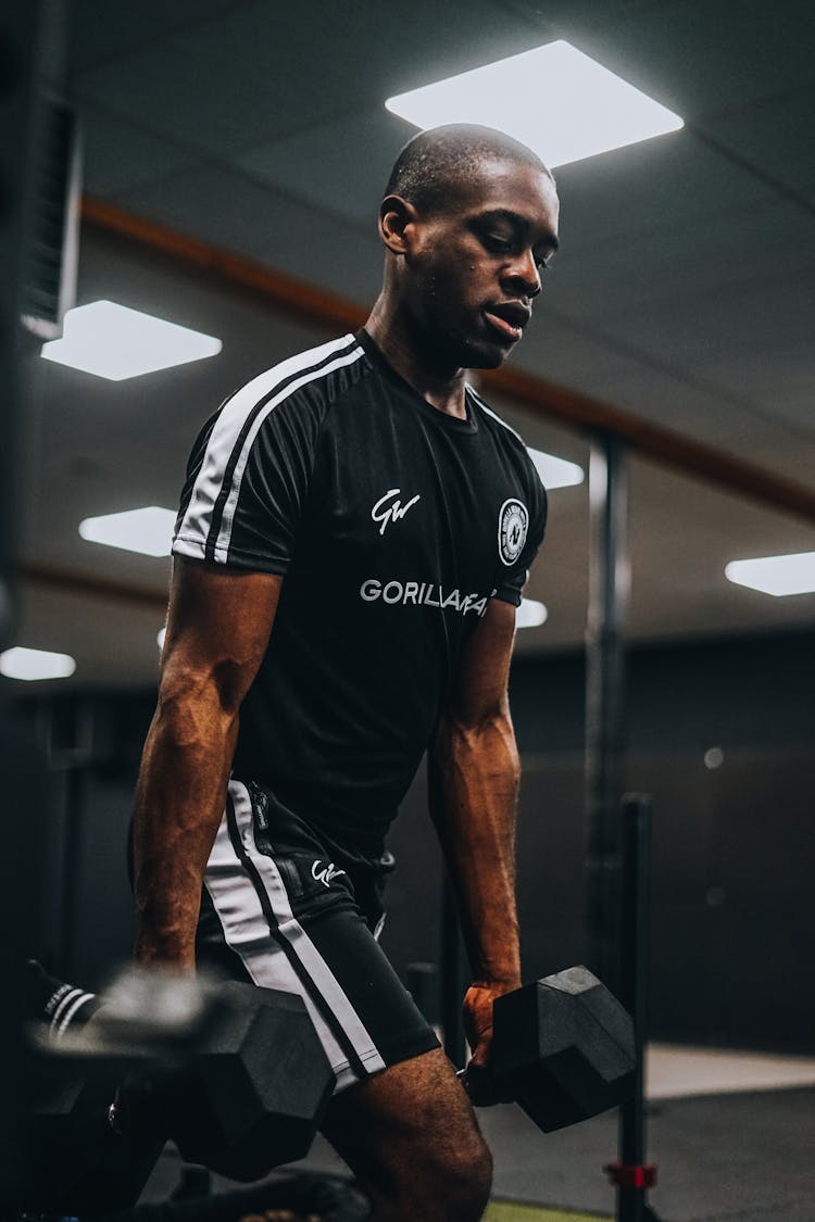 A Man Working Out At The Gym