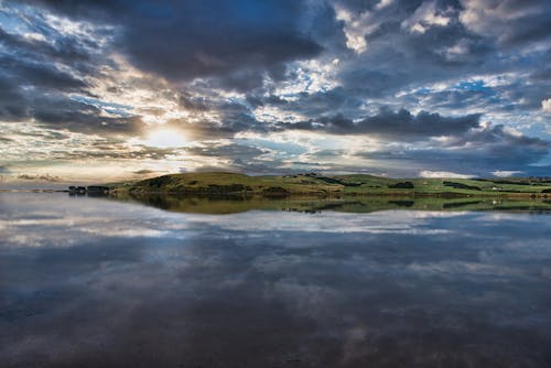 Photo of Lake under Cloudy Sky