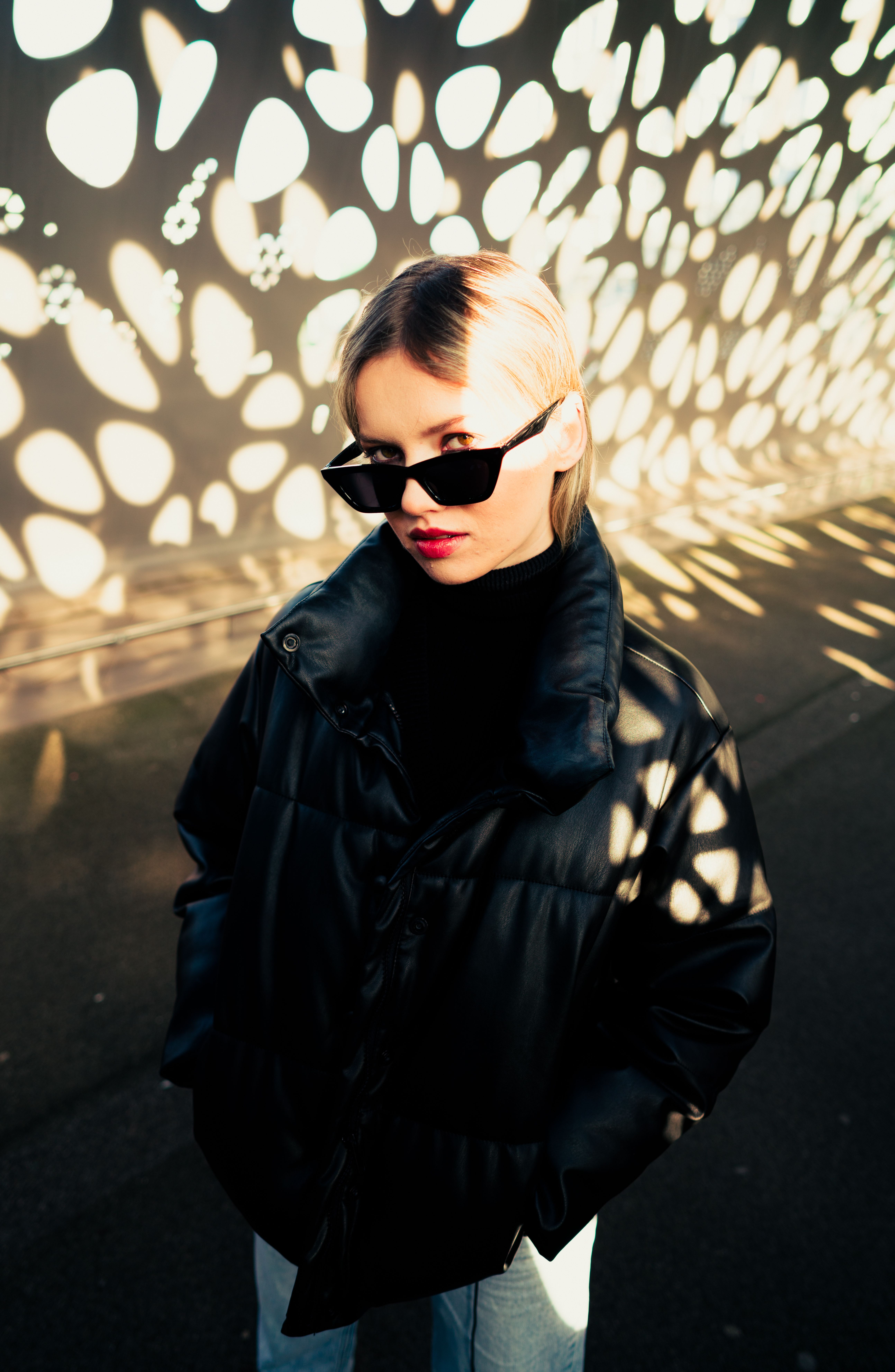 Woman in Black Leather Jacket Wearing Black Sunglasses · Free Stock Photo