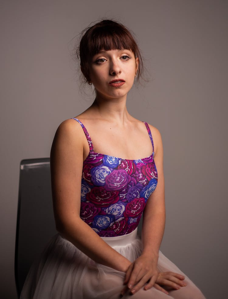 A Woman Sitting On A Chair