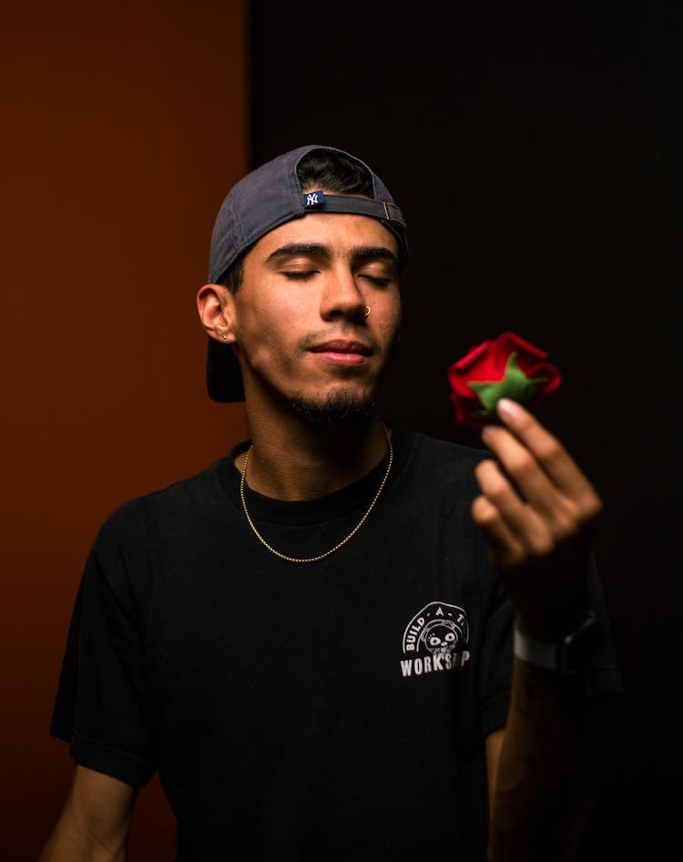 A Man Holding A Flower