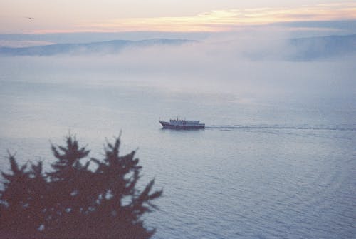 Boat on Lake on Foggy Day