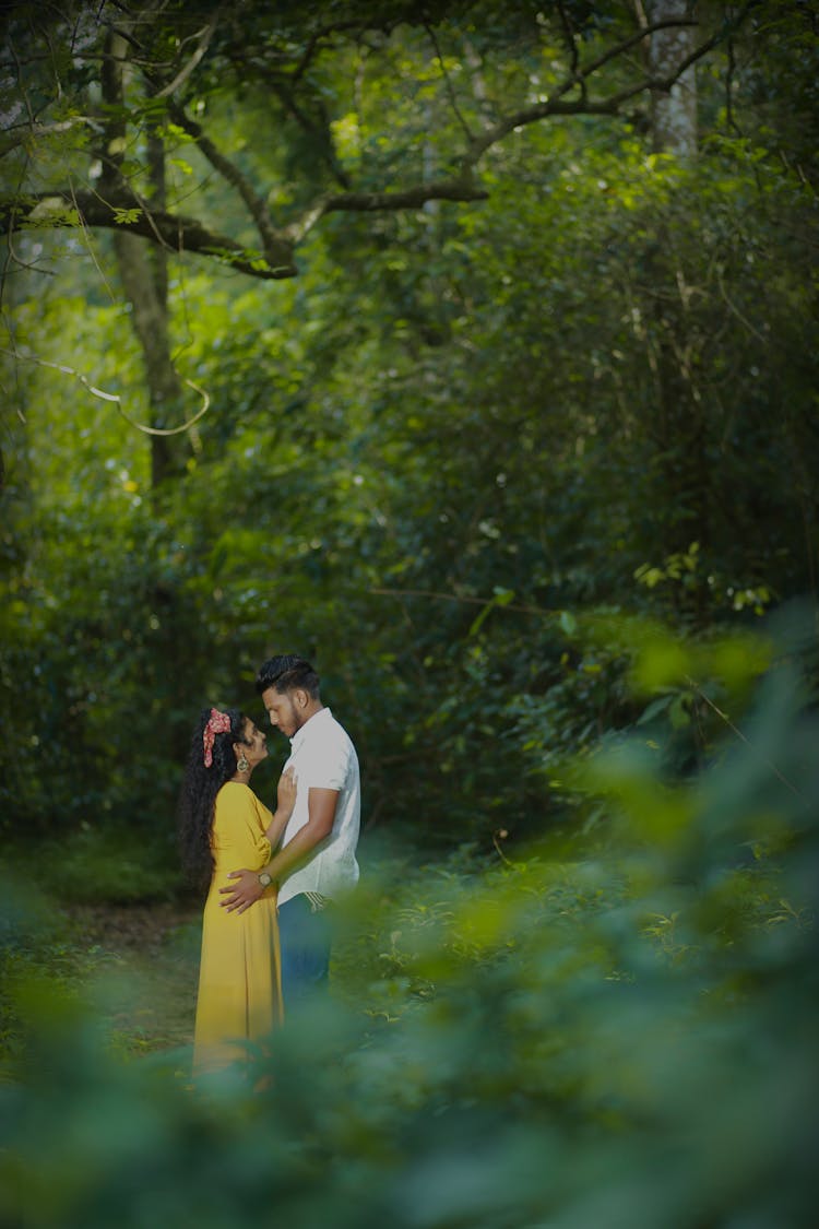 Affectionate Couple Standing In A Park