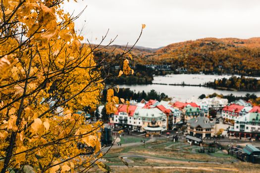 Captivating autumn view of Mont-Tremblant with colorful foliage and village houses.